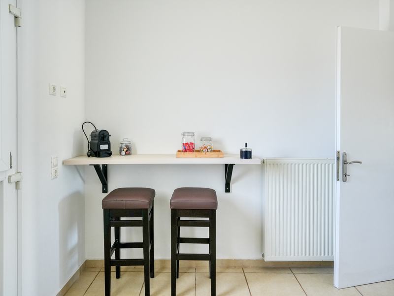Breakfast bar with two stools and coffee corner